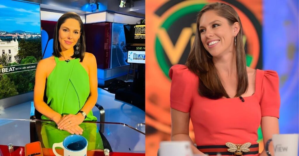 A person in a pink coat sitting on chair in front of a table