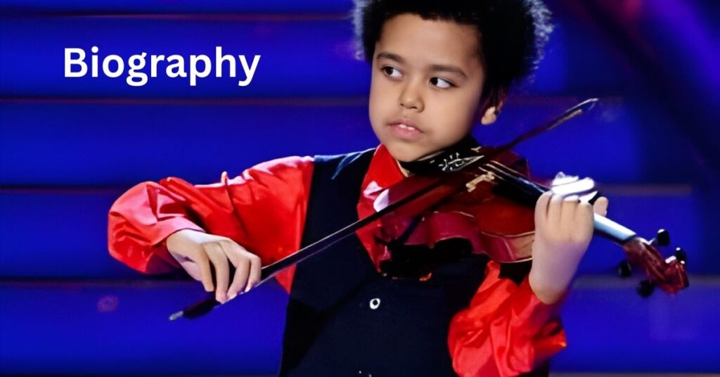 A young person with an afro plays the violin on a stage with a blue, tiered background.