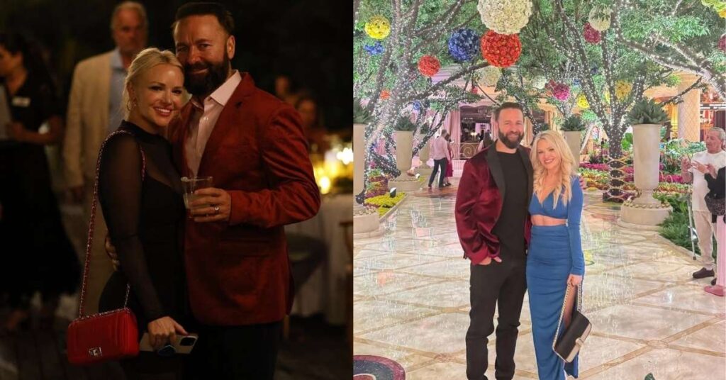 Amanda Leatherman and her husband took a photo in a beautifully decorated walkway with floral arrangements and illuminated trees.