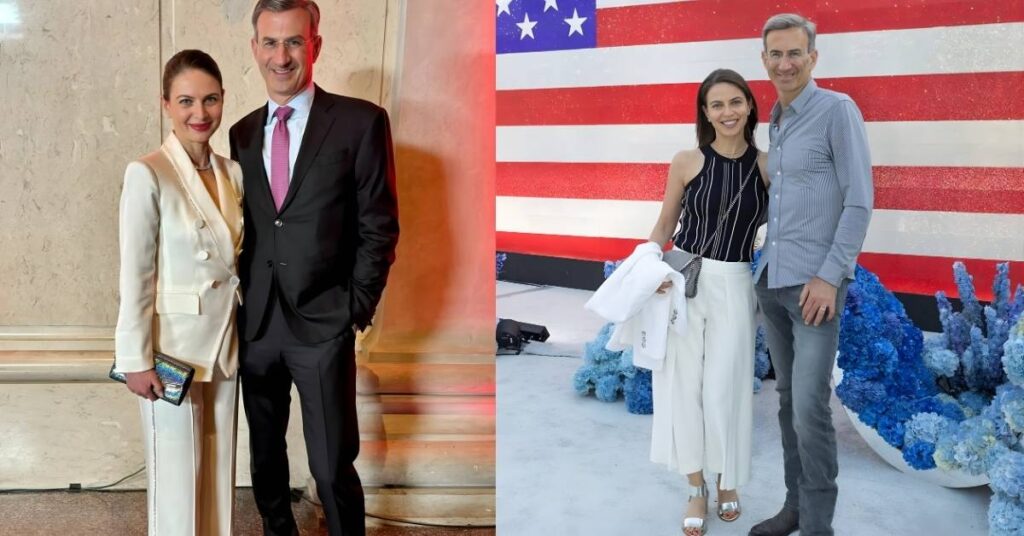 Bianna Gologdryga, in a cream-colored suit, and a person in a black suit stand side-by-side, posing for a photo.