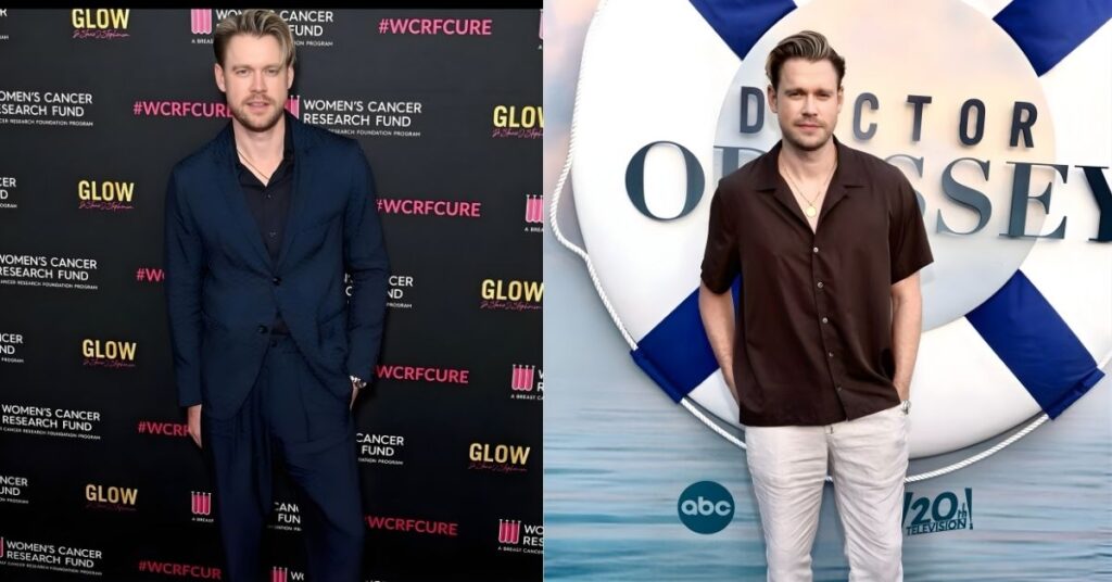 Chord Overstreet, in a brown short-sleeved shirt and light-colored pants, stands in front of a backdrop with the words Doctor Odyssey on a life preserver.