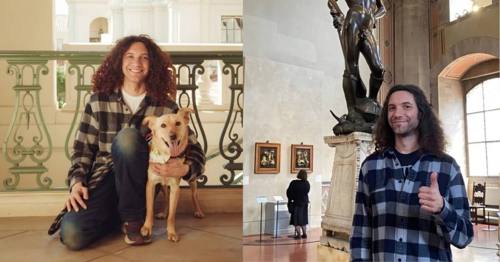 Dan Avidan gives a thumbs up in front of Michelangelo's David sculpture in a museum.
