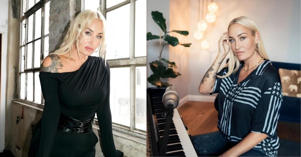 Sarah Connor, with blonde hair and a tattoo on her shoulder, wears a black off-the-shoulder dress cinched with a wide belt, posing by a window.