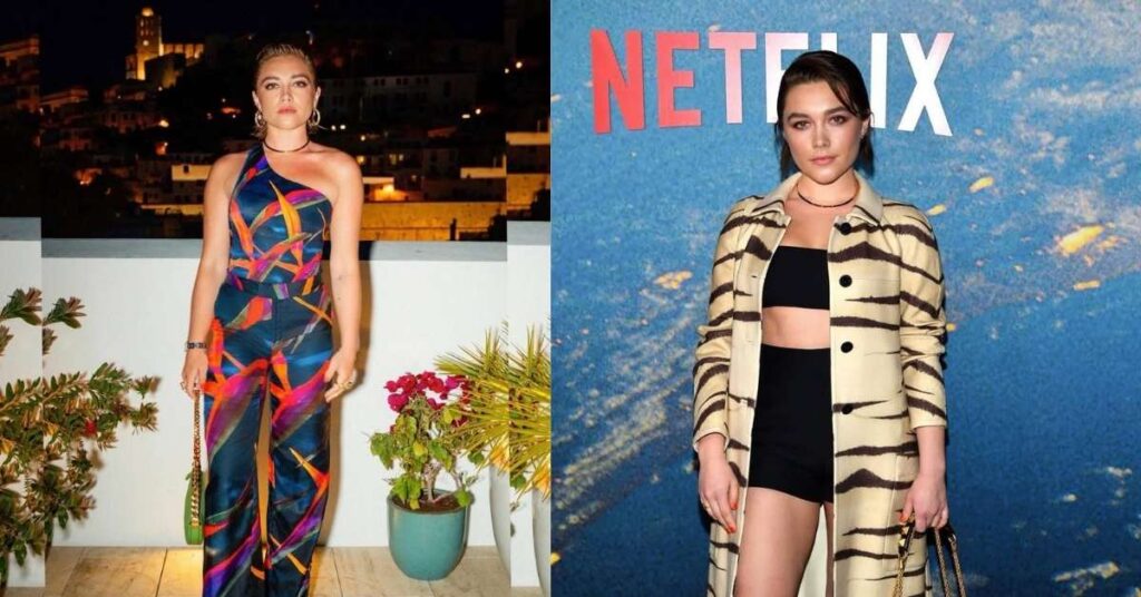 Florence Pugh, in a black leather dress with shoulder pads and large, light-colored earrings, stands against a blue textured background.