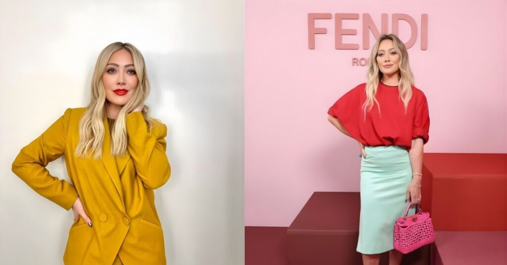 Hilary Duff, wearing a mustard yellow double-breasted suit with a matching pantsuit, bright red lipstick, and blonde hair styled with soft waves.
