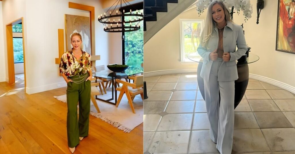 Kendra Wilkinson stands in a modern dining room wearing a floral print shirt and green wide-leg pants.