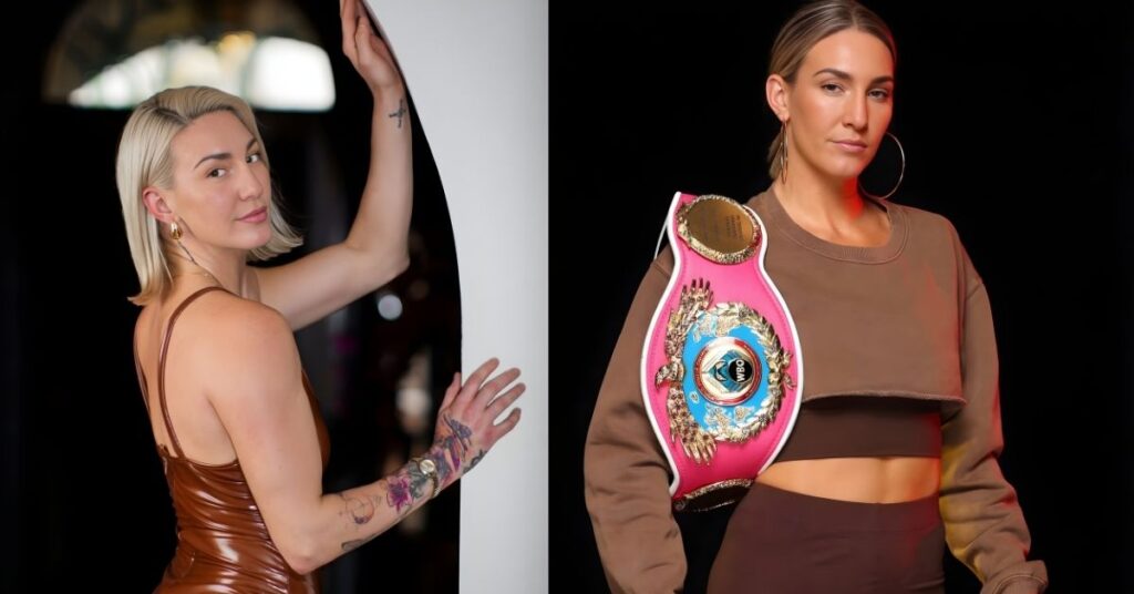 Mikaela Mayer, wearing a brown crop top and dark brown leggings, poses with a championship belt with a pink strap over her shoulder.