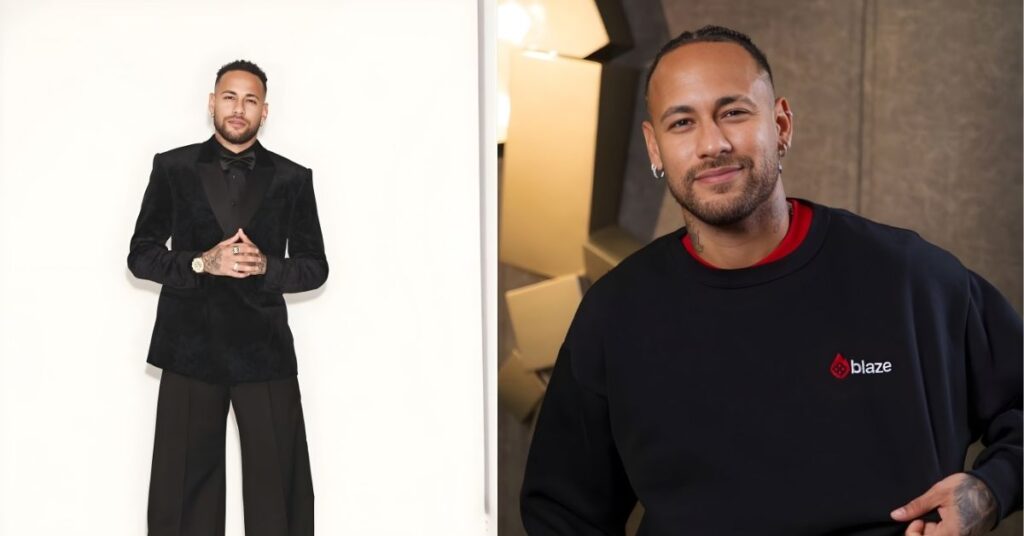 Neymar Jr stands in a black velvet blazer and wide-leg black pants against a white background. They are wearing a black bow tie and a watch on their left wrist.