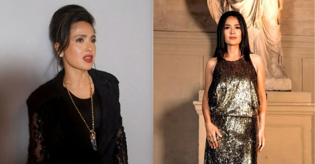 Salma Hayek stands in a sequined gold dress in front of a marble statue.