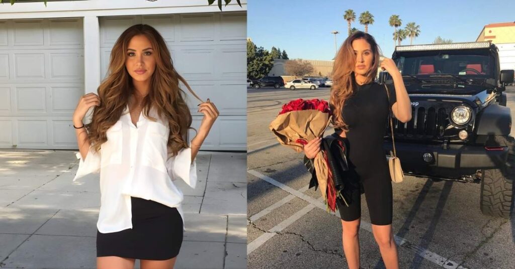 Catherine Paiz, with long, wavy brown hair, wearing a white blouse and a black skirt, stands in front of a white garage door.