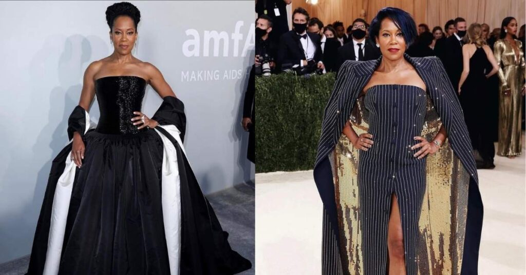 Regina King, in a black and white strapless ball gown with a sparkly bodice and a voluminous skirt, stands with their hands on their hips.