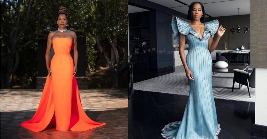 Regina King, wearing a light blue, floor-length gown with ruffled sleeves and silver embellishments, stands in a modern living room.