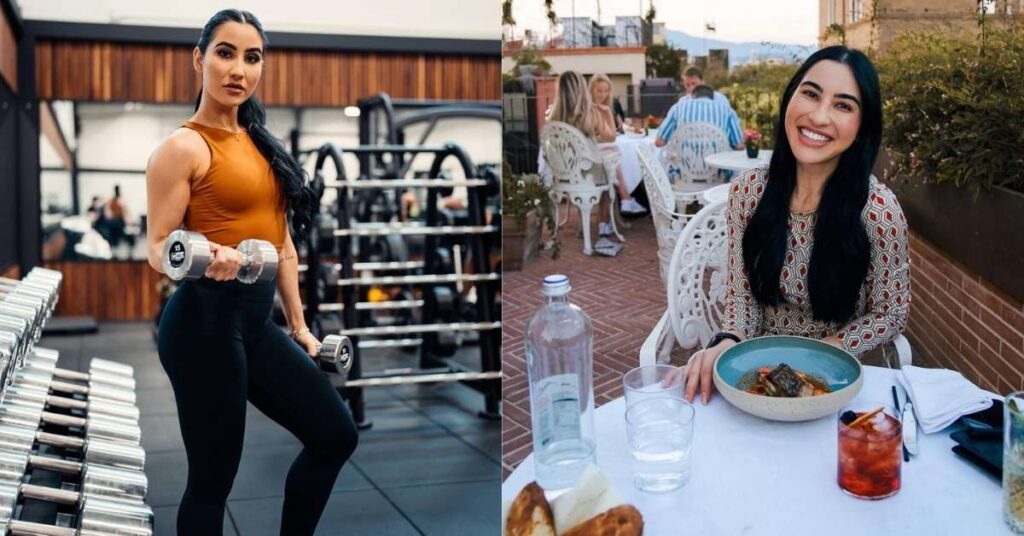 Stephanie Buttermore, in athletic wear, holds dumbbells while standing in a gym, with rows of weights and gym equipment in the background.