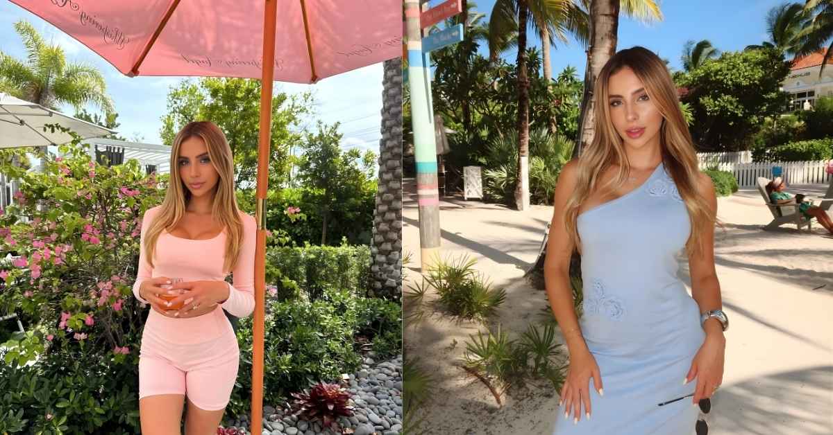 Bruna Lima, wearing a light blue one-shoulder maxi dress, stands on a sandy beach with palm trees and lounge chairs in the background.