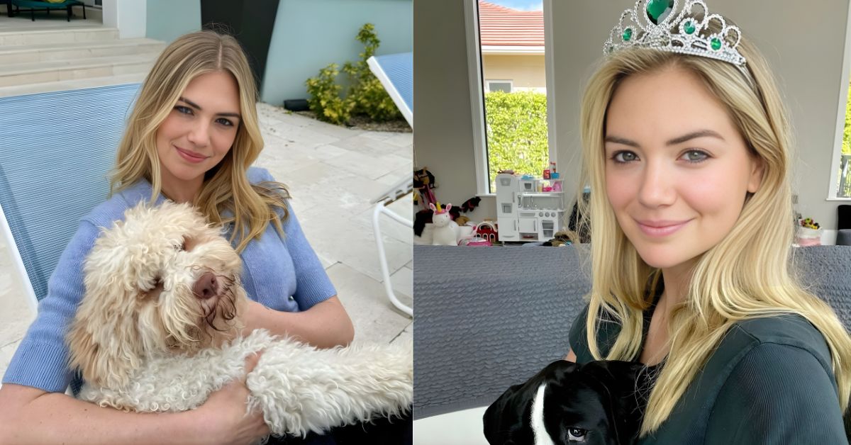 Kate Upton, wearing a tiara, holds a black and white dog while smiling at the camera. In the background, a toy kitchen and a unicorn are visible.