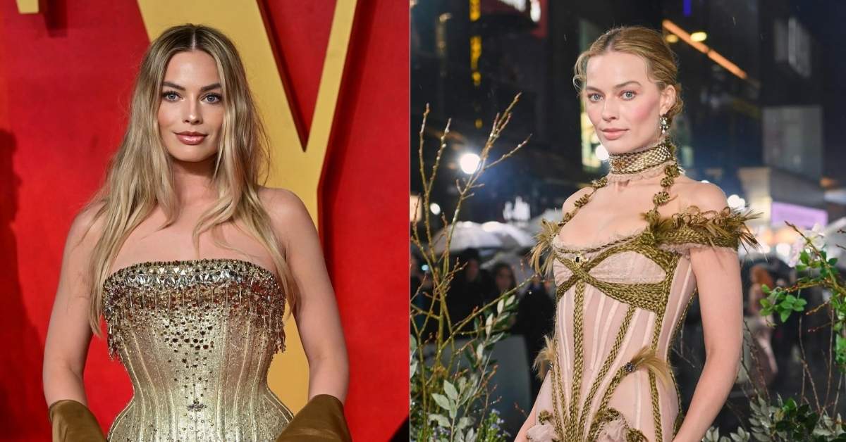Margot Robbie, in a strapless, gold, jeweled corset with flowing sleeves, stands against a red and yellow backdrop.