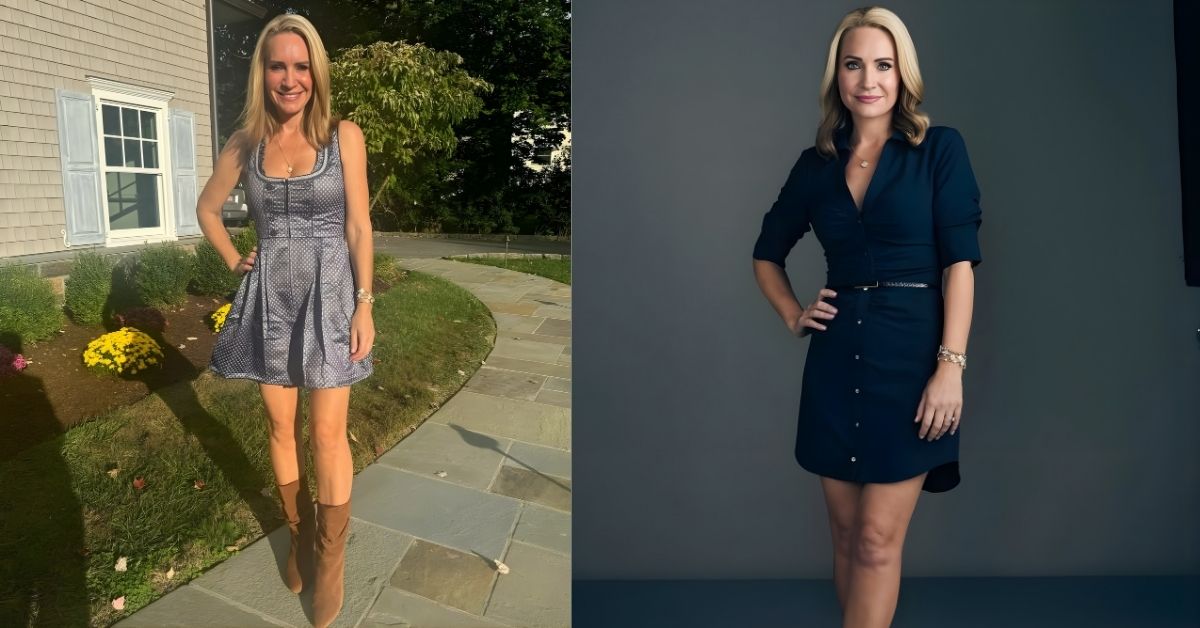Andrea Canning is wearing a dark blue button-up dress and black heels poses with one hand on her hip.